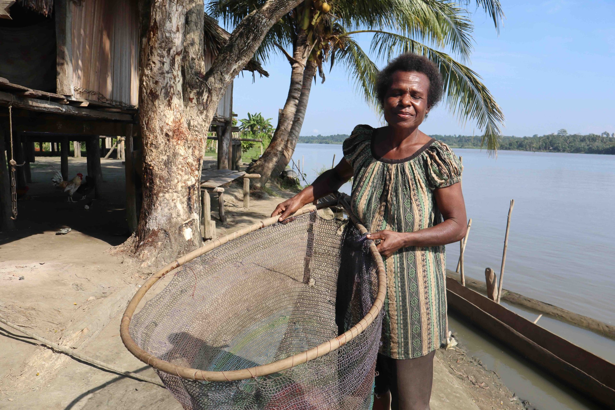 Helen Asu holding an Umben