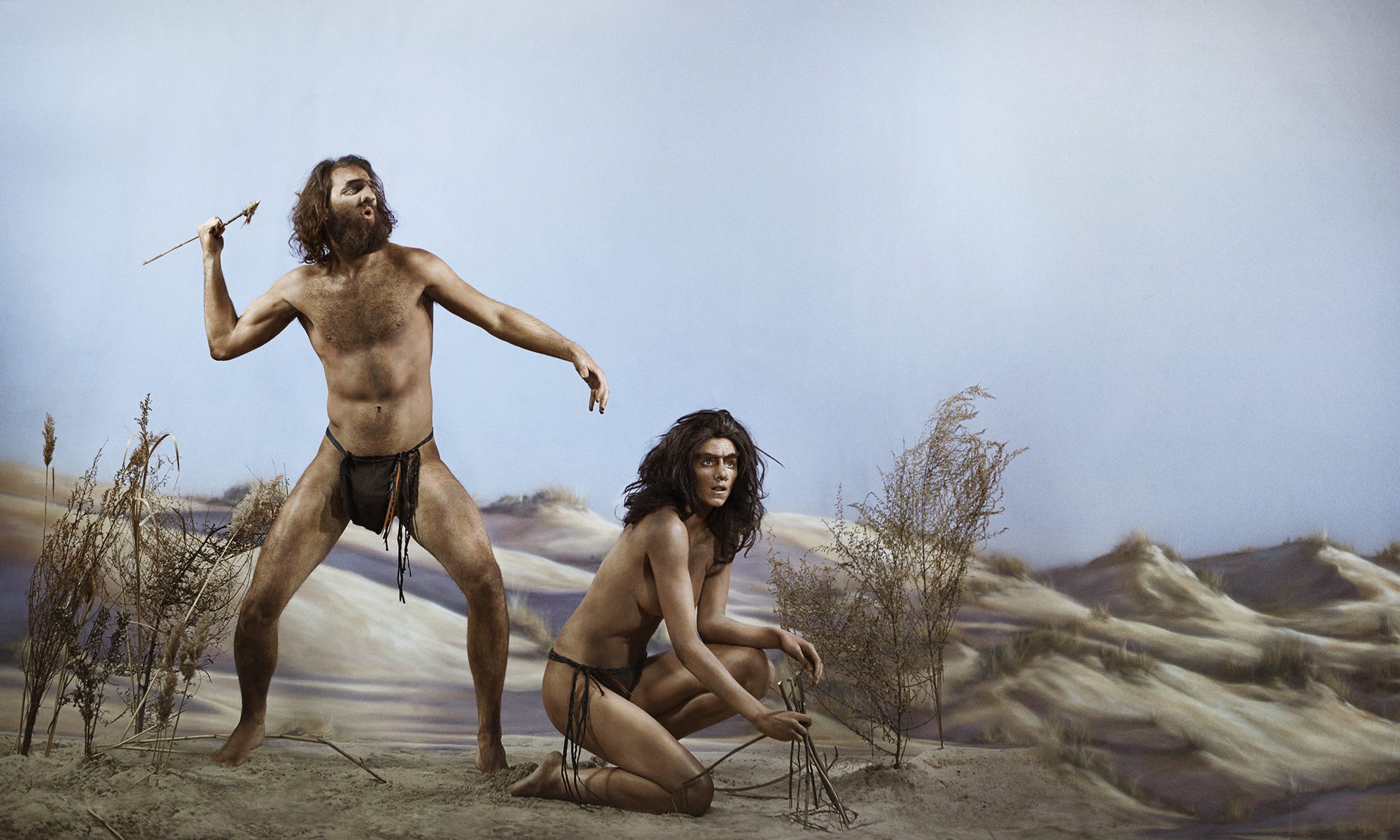 illustration of prehistoric man and woman