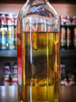 Bottle of Mezcal with worm. © Esdelval/Getty Bottle of Mezcal with worm. © Esdelval/Getty