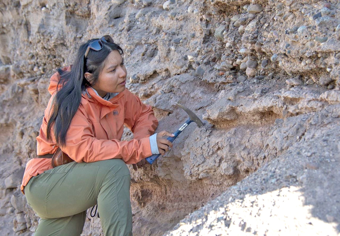 Woman examining rock